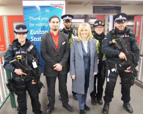 Esther McVey with officers at Euston